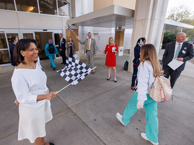 Children's of Mississippi COO Lorna Kernizan, left, and other UMMC leaders greet employees arriving at the Adult Hospital on Monday to kick off Patient Safety Week.